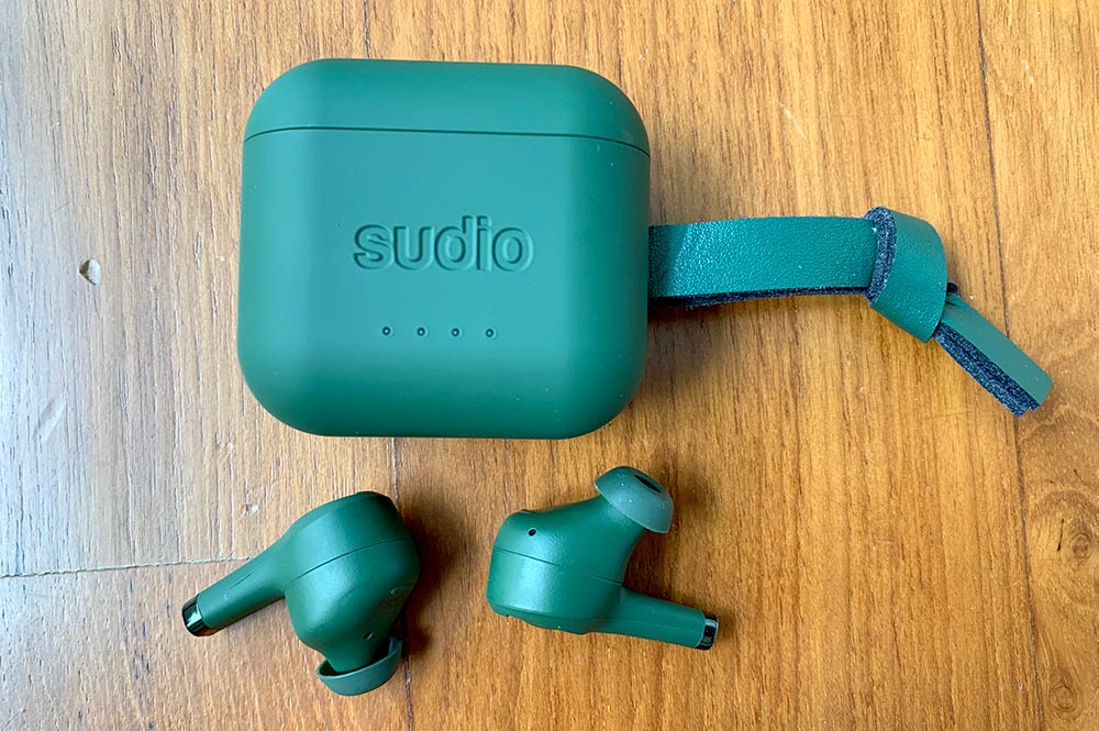 Sudio Ett earbuds and case - the green is more of an olive shade