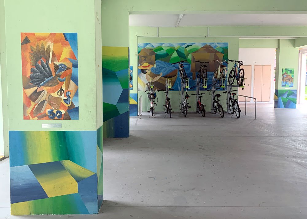 Various local landmarks depicted in cubism style painted on the void deck pillars