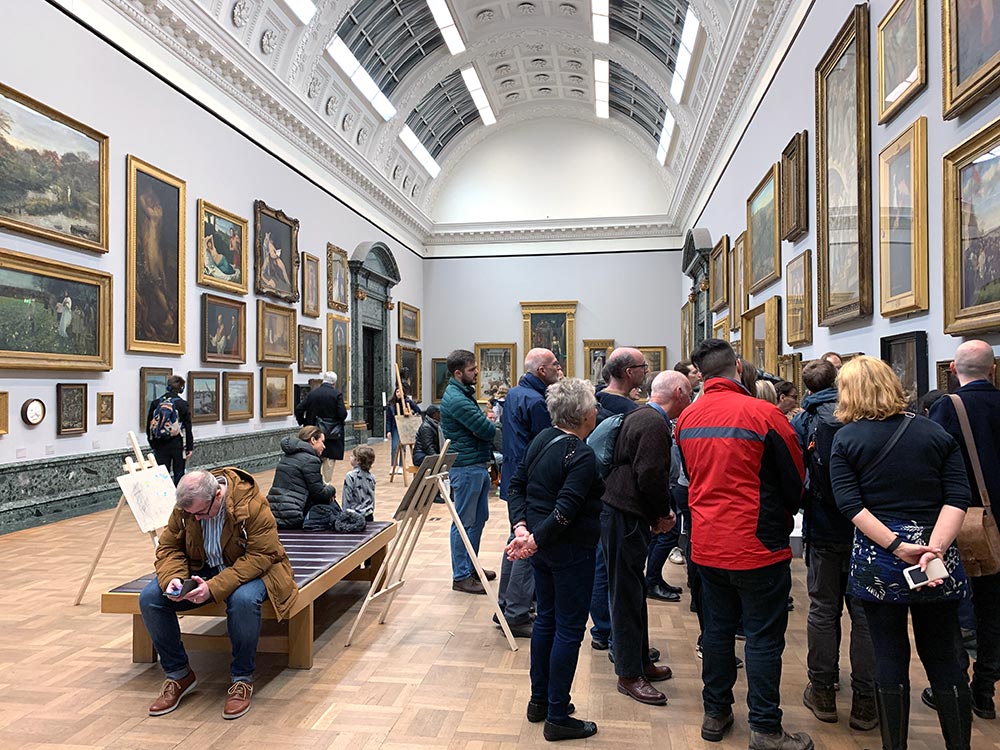 People looking at art in Tate Britain Gallery
