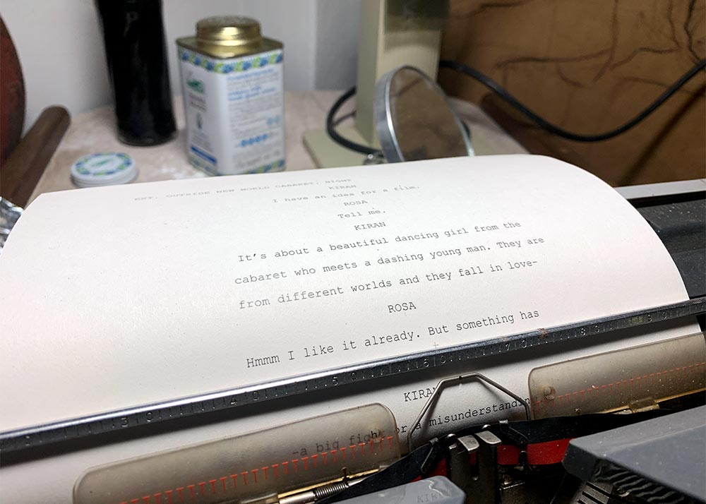 Closeup of a typewriter with some text describing the story in the tour